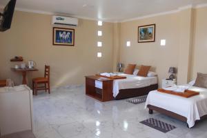 Voodi või voodid majutusasutuse Hostal Romy toas
