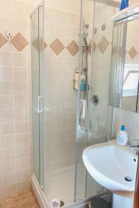 a bathroom with a shower and a sink at The House Fiera di Roma Aeroporto Fiumicino in Ponte Galeria +42 photos