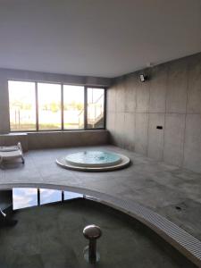 a large bathroom with a tub in the middle at Marina View 15 & SPA in Dziwnów