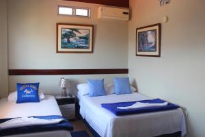 Voodi või voodid majutusasutuse Hostal Romy toas