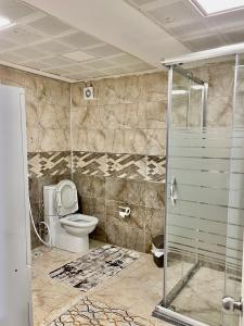 a bathroom with a toilet and a shower at Bigger house in Beylikduzu in Buyukcekmece