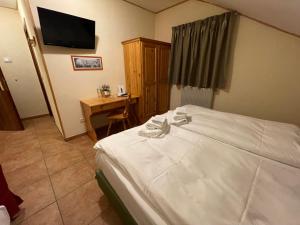 Postel nebo postele na pokoji v ubytování Hotel Trieste