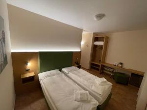 Postel nebo postele na pokoji v ubytování Hotel Trieste