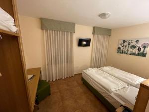 Postel nebo postele na pokoji v ubytování Hotel Trieste