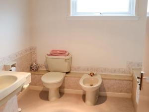 a bathroom with a toilet and a sink at Keith House in Thurso
