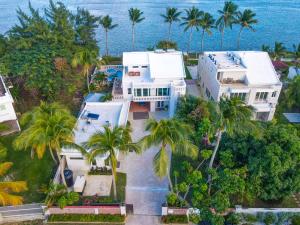 an aerial view of a white house with palm trees at Newly Renovated 8 Bedroom Ocean Front Villa with Pool in Rio Grande