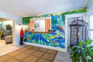 a room with a large painting on the wall at Island Motel OBX in Manteo