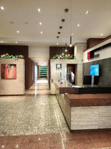 a lobby of a hotel with a reception desk at Hotel El Salvador in Mexico City