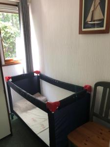 Postel nebo postele na pokoji v ubytování Cedar Cottage Veluwe