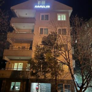 a tall building with a sign on the side of it at Kamelya in Nilüfer