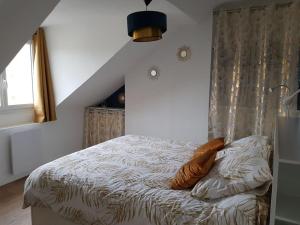 Łóżko lub łóżka w pokoju w obiekcie Appartement lumineux et moderne