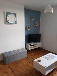 Telewizja i/lub zestaw kina domowego w obiekcie Appartement lumineux et moderne