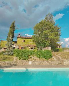 an external view of a house with a swimming pool at la Terrazza with pool 1st June to 30th August in Talla