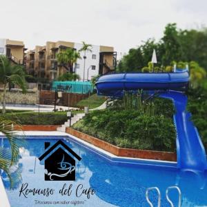 a blue water slide at a water park at Remanso del café in La Tebaida