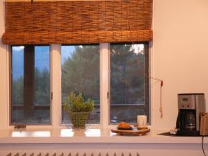 a window with a wicker shade on top of a counter at Adirondack Mountain View Retreat in Elizabethtown