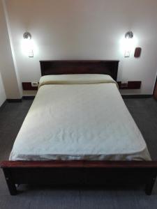 En eller flere senge i et værelse på Alojamiento Avellaneda