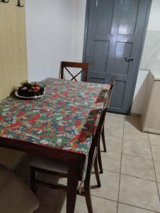 a dining room table with a table cloth on it at Villas Irene 3 Family Apartments in Gournes