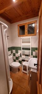 a bathroom with a toilet and a sink at La Senra in León