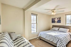 a bedroom with two beds and a ceiling fan at Delafield Vacation Rental Near Lakes and Parks! in Delafield