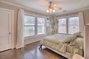 a bedroom with a bed and a ceiling fan at Charming Historic Houston Home with Yard! in Houston