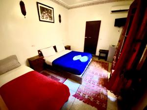 Postel nebo postele na pokoji v ubytování Riad Jibraile