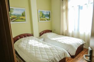 Katil atau katil-katil dalam bilik di Hotel Celiku