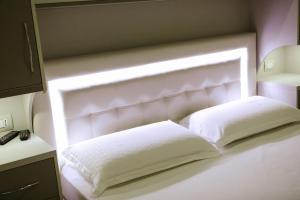 Katil atau katil-katil dalam bilik di Hotel Celiku