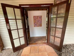 an open door with a painting on the wall at 305A - The Artist's Cottage in Montville