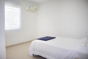 Postel nebo postele na pokoji v ubytování Apartamento en Valledupar - Casa Canaán