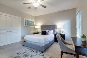 a bedroom with a bed and a desk and a table at I luv Nash - Minutes from Broadway! in Nashville