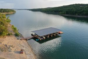 an aerial view of a dock in a river at The Bavarian Village Resort in Branson