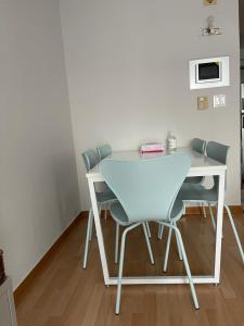 a white table and chairs in a room at Hongdae Residence-4 - 1min from Hongik Univ Station #1 in Seoul