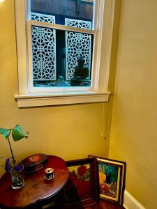 a room with a table and a window at Forest Park Sanctuary in Portland