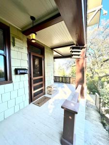 a porch with a bench in front of a building at Forest Park Sanctuary in Portland