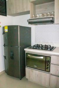 Küche/Küchenzeile in der Unterkunft Apartamento encantador en bello(cabañas)
