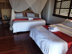 Letto o letti in una camera di Miley Lodging Restobar