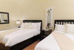 A bed or beds in a room at The Riverside Inn