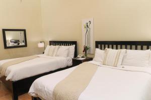 A bed or beds in a room at The Riverside Inn