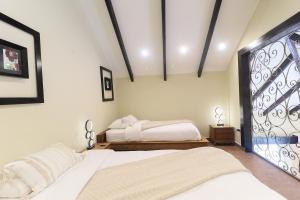A bed or beds in a room at The Riverside Inn