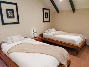 A bed or beds in a room at The Riverside Inn