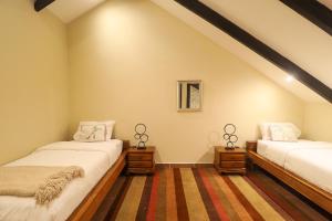 A bed or beds in a room at The Riverside Inn