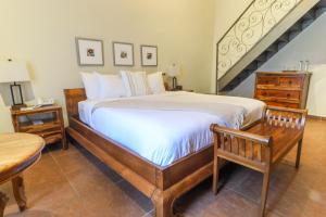 A bed or beds in a room at The Riverside Inn