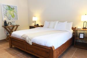 A bed or beds in a room at The Riverside Inn
