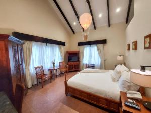 A bed or beds in a room at The Riverside Inn