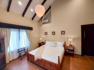 A bed or beds in a room at The Riverside Inn