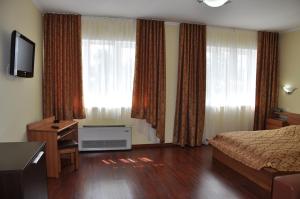 Кровать или кровати в номере Гостиница Дворик