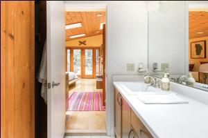 a bathroom with a sink and a mirror at Sur Grove Big Sur in Big Sur