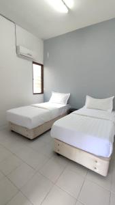 Postel nebo postele na pokoji v ubytování Pusing Holiday Apartment + 1 fotografie