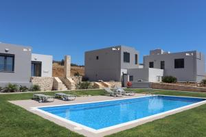 a swimming pool in the yard of a villa at Triopetra View 2 in Triopetra