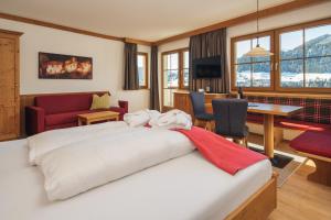Postel nebo postele na pokoji v ubytování Hotel Garni am Sonnberg